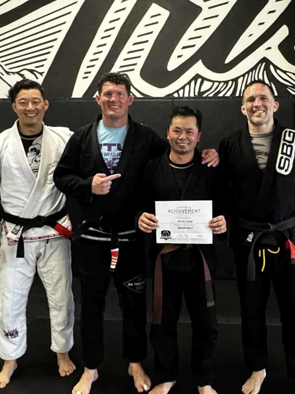  Athletes at SBG Atlanta celebrating their black and brown belt promotions at the Ironman Belt Ceremony.