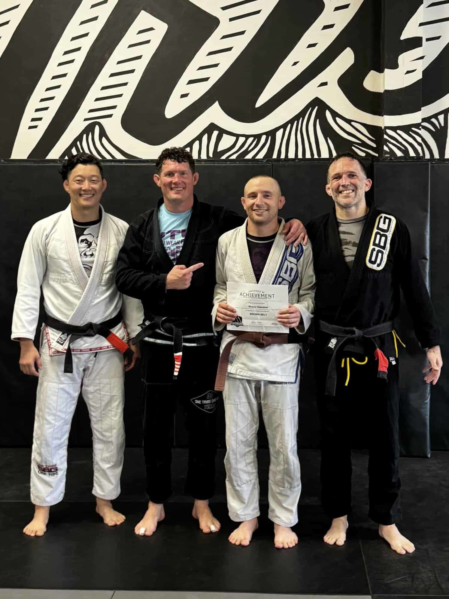  Athletes at SBG Atlanta celebrating their black and brown belt promotions at the Ironman Belt Ceremony.