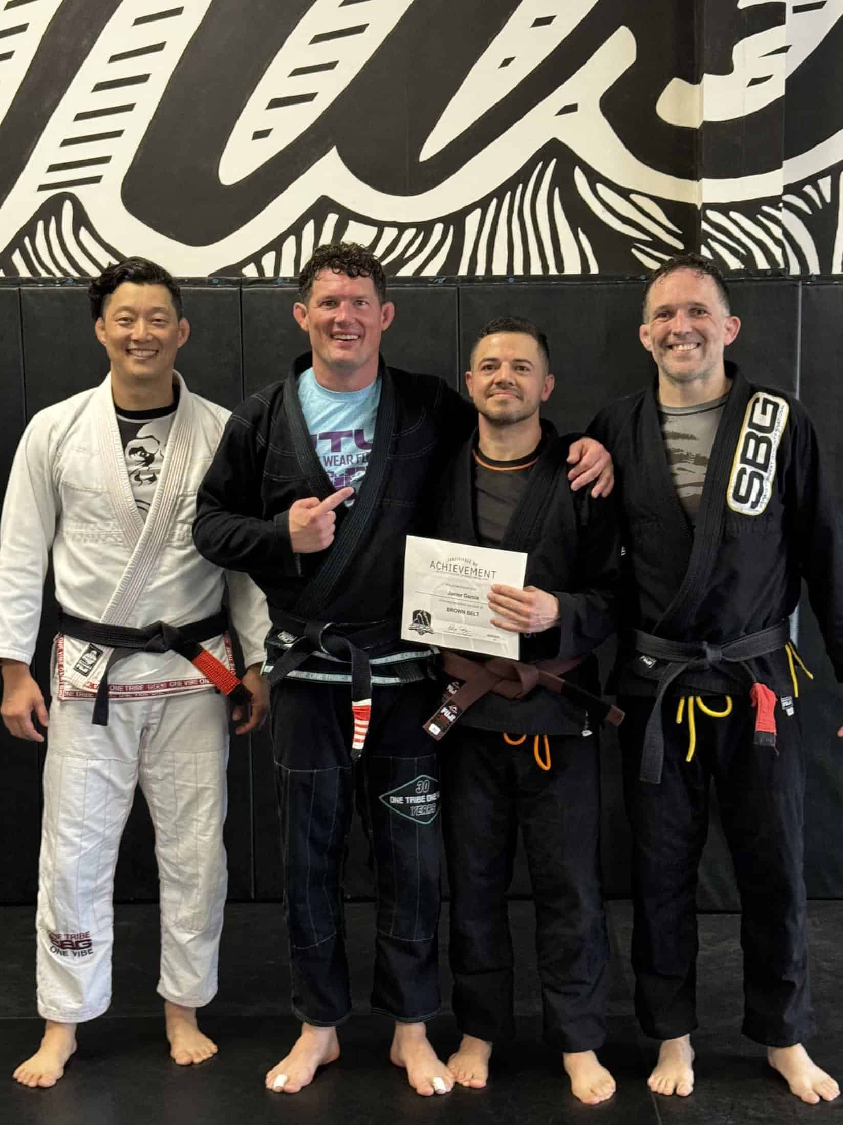  Athletes at SBG Atlanta celebrating their black and brown belt promotions at the Ironman Belt Ceremony.