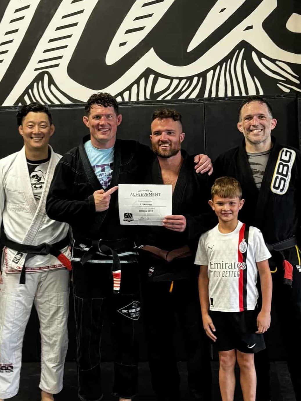  Athletes at SBG Atlanta celebrating their black and brown belt promotions at the Ironman Belt Ceremony.