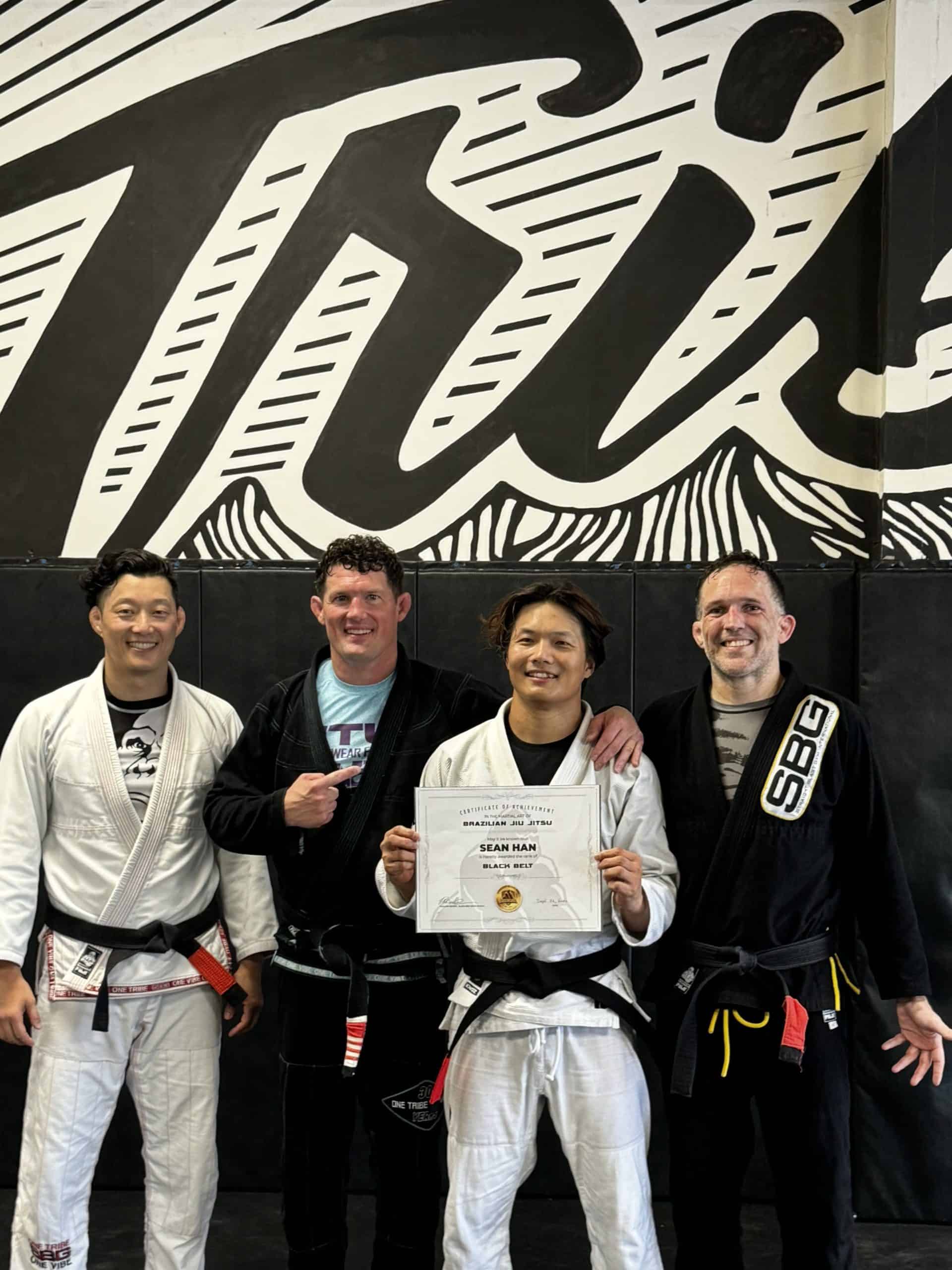  Athletes at SBG Atlanta celebrating their black and brown belt promotions at the Ironman Belt Ceremony.