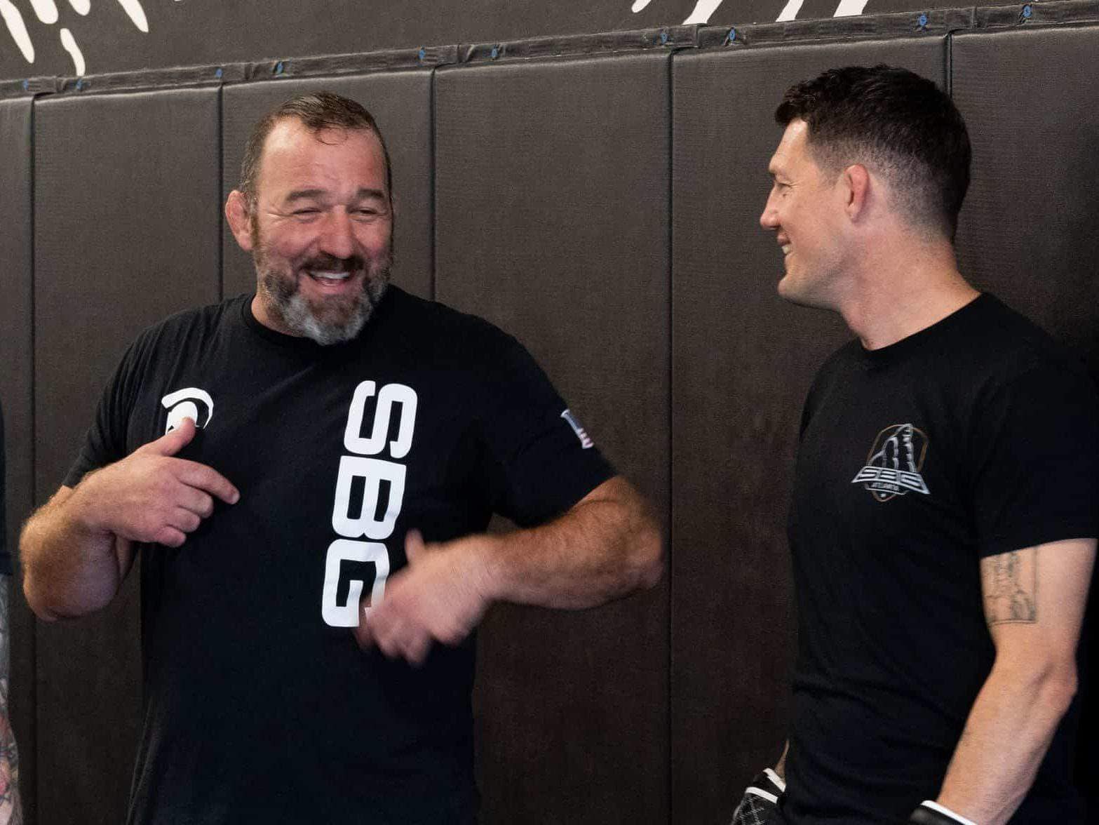 Head Coaches laughing and smiling at SBG
